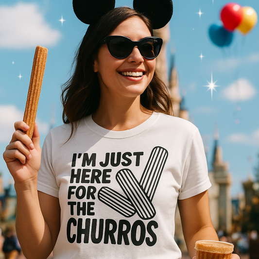 Woman wearing sunglasses and Mickey Mouse ears, holding a churro and a cup, with a castle and balloons in the background.