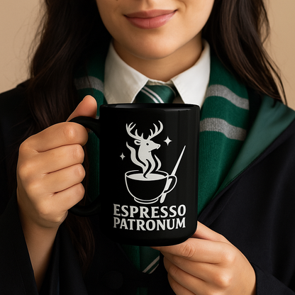 Person holding a black mug with 'Espresso Patronum' design, wearing a green and white striped scarf.